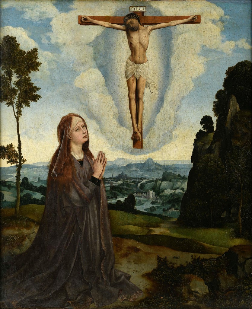 Our Lady in a landscape praying before the Crucified Christ